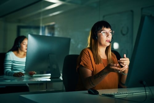 Positive Positioning Cropped shot of an attractive young female call center agent working late at night in her office