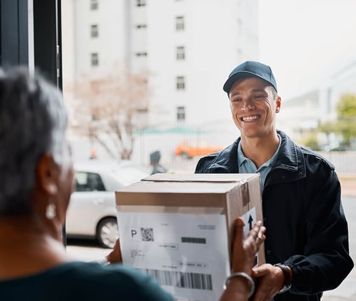 delivery man dropping off a package to a woman delivery man dropping off a package to a woman