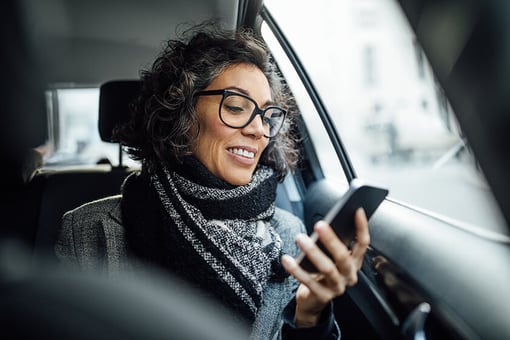 passenger woman in car looking at phone passenger woman in car looking at phone