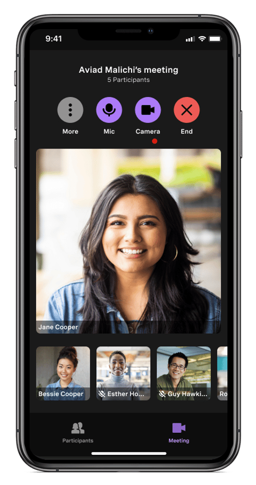 Vonage meetings on a phone via VBC Mobile app VBC Mobile app hosted meeting featuring several participant faces on video