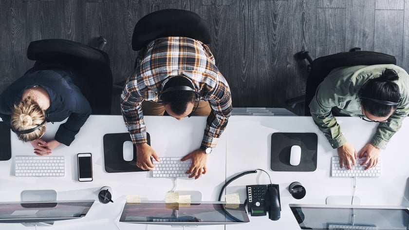 Contact Center Agents High angle shot of a group of call centre agents working in an office